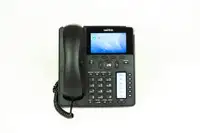 Telefono IP VoIP da ufficio appoggiato su una scrivania